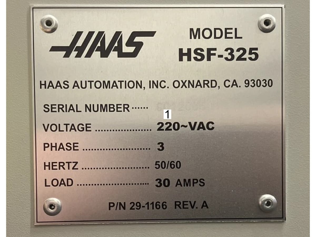 Фотография заводской таблички HSF-325 из руководства Haas; поле серийного номера пустое.